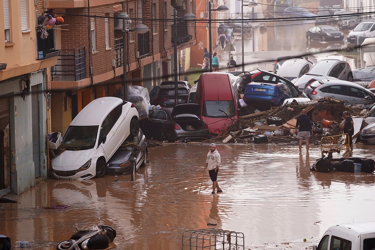 Flash floods in Spain sweep away cars, disrupt trains and leave several missing