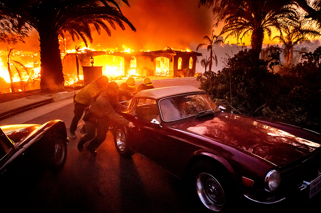 Wildfires spread across Southern California, destroying homes and