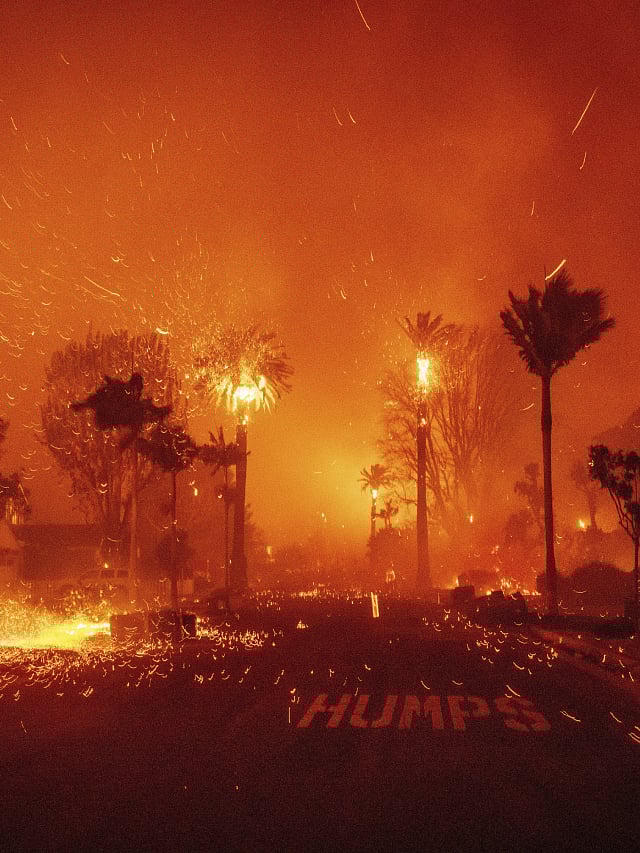 Thousands flee as wildfires rage around Los Angeles, destroying homes 