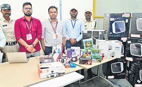 BIS officials with consumer goods seized from Amazon warehouse on Wednesday