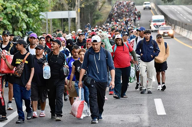 Migrants walk through Tapachula, Chiapas state, Mexico, in an attempt to reach the US border on Monday, Jan. 20, 2025, the inauguration day of US President Donald Trump. 
