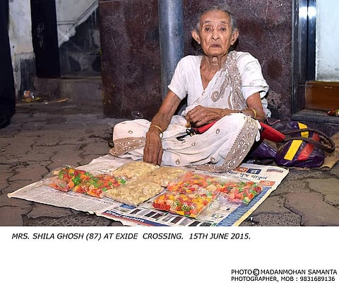  the old lady has to carry on her daily routine of selling savories in front of Exide. (MadanMohan Samanta)