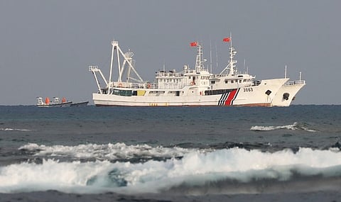 A file photo showing China Coast Guard vessels at the disputed Scarborough Shoal, April 5, 2017.