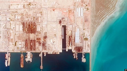 This satellite photo from Planet Labs PBC shows the Iranian Revolutionary Guard's newest ship, the Shahid Mahdavi, center right, under construction in a shipyard west of Bandar Abbas, Iran, May 21, 2022.