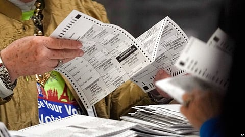 Election workers process ballots at the Clark County Election Department, Nov. 10, 2022, in Las Vegas.