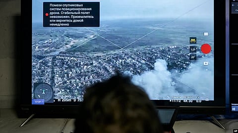 A Ukrainian soldier watches a drone feed from an underground command center in Bakhmut, Donetsk region, Ukraine, Dec. 25, 2022. (AP Photo/Libkos)