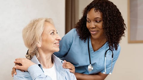 Nurse comforting an elderly woman