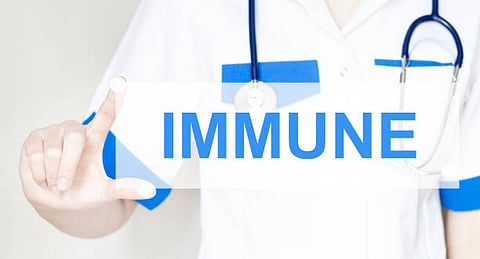 Doctor pointing at the word IMMUNE.