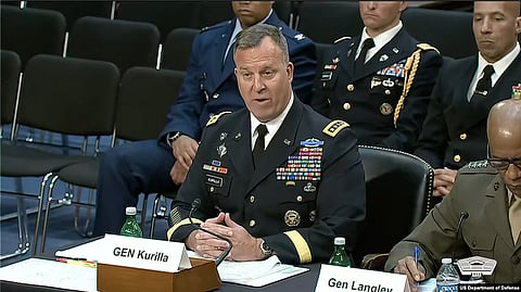 A  military general in uniform sitting at a desk with a nameplate reading “GEN Kurilla.”