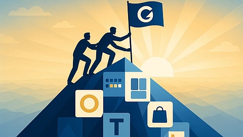Two men wave flag at top of the mountain.