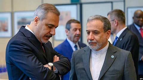 Iranian Foreign Minister Abbas Aragchi (right) speaks with Turkish counterpart, Hakan Fidan, in June. Iran says it will meet with European powers in Istanbul on July 25.
