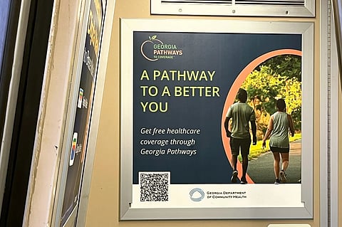 A train advertisement in Atlanta on May 26 promotes Georgia Pathways to Coverage, which conditions Medicaid coverage on working, studying, or volunteering. (Gabe Brison-Trezise/KFF Health News)