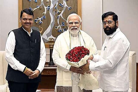 The image shows that modi ji is taking a bouquet