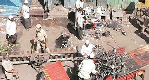 The image is shown of the police and other cleaning after the blast of malegaon
