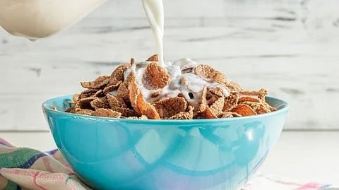 An image of cereals and milk filled bowl