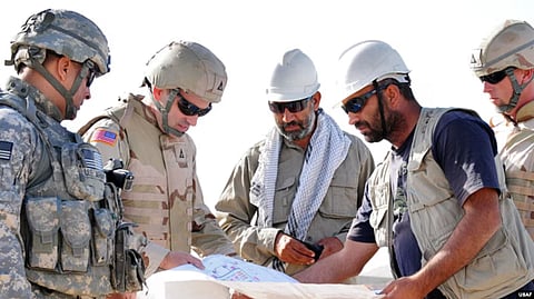 in the image Afghan engineers and Afghan army is shown discussing in a topic.