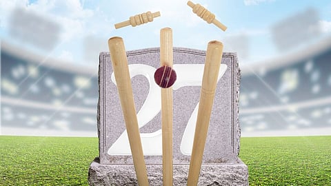 In the image wickets are shown and a ball is strike on them and 27 is written in a cemented wall and the background is of a stadium