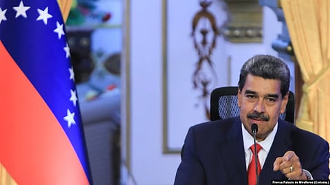 In the image president of Venezuela is shown speaking through the mike