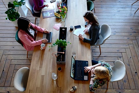 3 women working in their office