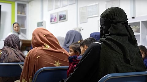 Afghan women attend a midwifery course before it was shut down by Taliban forces