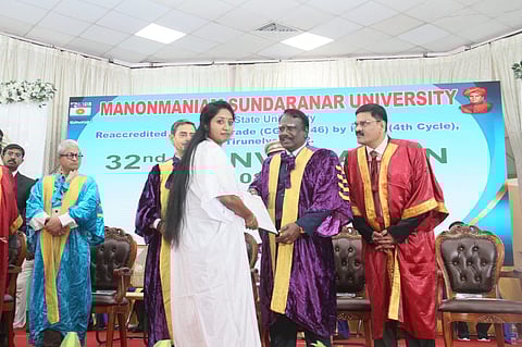 image of PhD scholar Jean Joseph V receiving her degree from VC instead of Governor Ravi