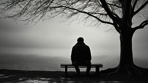 A depressed man sitting 