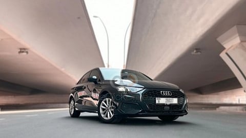 Front three-quarter view of a black Audi A3 sedan available for car rental Abu Dhabi.