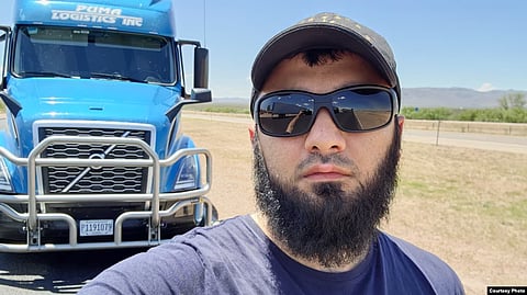Kishukov in an enclosure in a Russian courtroom
