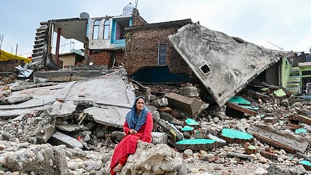 Jammu: A resident looks at the remains of their house damaged by flash floods along the banks of the Tawi River in Jammu, Thursday, August 28, 2025.