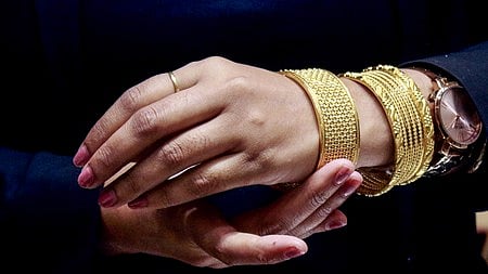 New Delhi: A sales assistant displays a collection of jewellery by showcasing it on her hands in New Delhi on Wednesday, April 30, 2025.
