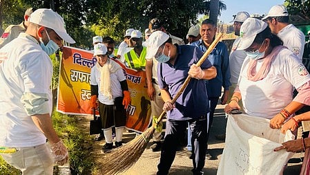 BJP leaders in Delhi hit the street, wielding brooms, to clean public spaces.