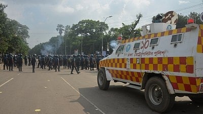 DHAKA, Aug. 6, 2018 (Xinhua) -- Police and an armored vehicle are seen during a demonstration for road safety in Dhaka, Bangladesh on Aug. 6, 2018.