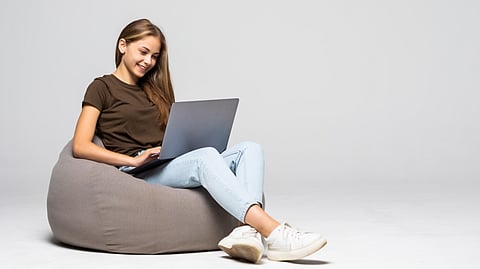 Woman sitting on laptop