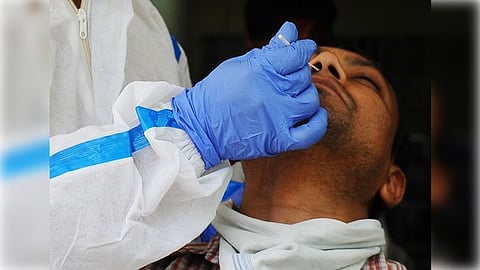 New Delhi: A healthcare worker collects a swab sample of a man for Covid-19 test, amid a sudden spurt in COVID 19 cases, in New Delhi, on Thursday, April 13, 2023