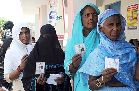 Women voters standing in a queue to cast their votes in Chhapra, Bihar.