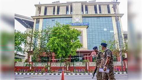 New Delhi: Delhi Police and Central Industrial Security Force (CISF) personnel stand guard outside the National Investigation Agency (NIA) headquarters in New Delhi on Friday, April 11, 2025.