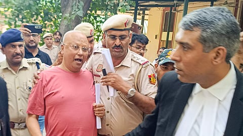 New Delhi: Delhi Police produce self-styled godman Chaitanyananda Saraswati, accused of sexually harassing 17 women students at a private institute in Agra, at the Patiala House Court in New Delhi on Sunday, September 28, 2025.