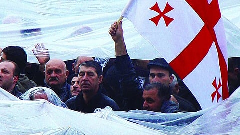 Image of protest with Georgian flag