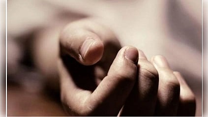 A close-up of a relaxed hand resting on a blurred surface, fingers gently curled. The soft lighting creates a calm, serene atmosphere.