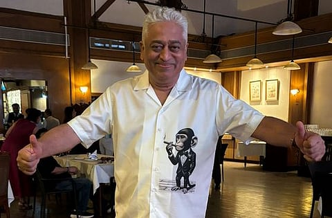 Rajdeep Sardesai giving a double thumbs-up