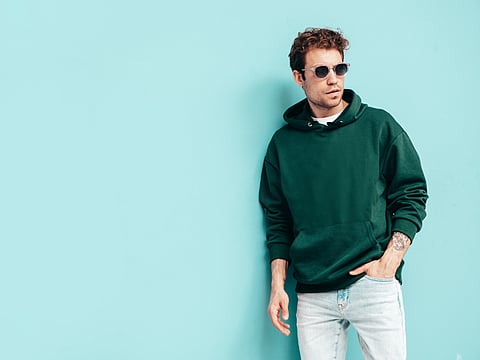 Man in hoodie posing