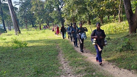 people with gun marching through the region