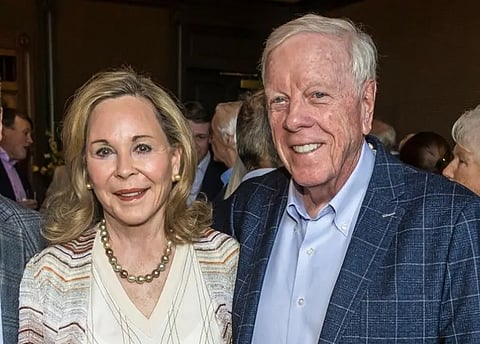 Nancy and Rich Kinder posing for a photograph.