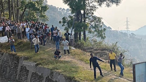 The locals taking part in the unique custom called as the "Pathar Mela" where they are throwing stone at each other.