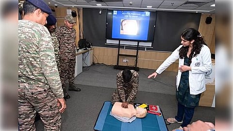 Indian Military demonstrating CPR techniques on a dummy during a training session focused on emergency response