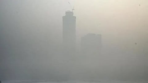 buildings barely visible through Delhi's pollution.
