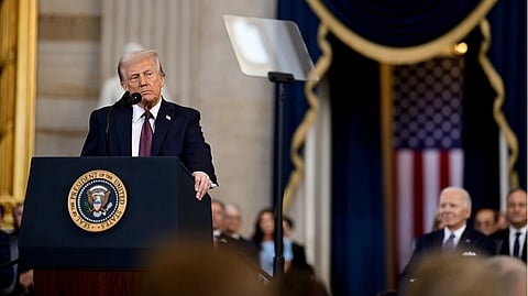 President Donald Trump giving a speech about their recent election. He is standing in the podium with people being seated in the background. 