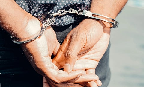 image of a man wearing handcuff.