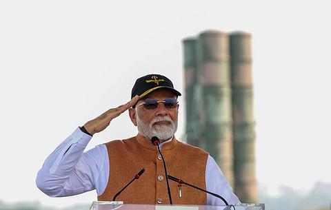 Image of PM Modi saluting in front of an S-400 launcher at the Adampur air base.
