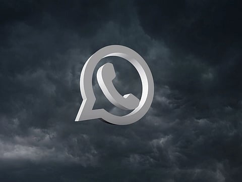 In the image there is hurricane in the background and above that is the white sign of whatsapp